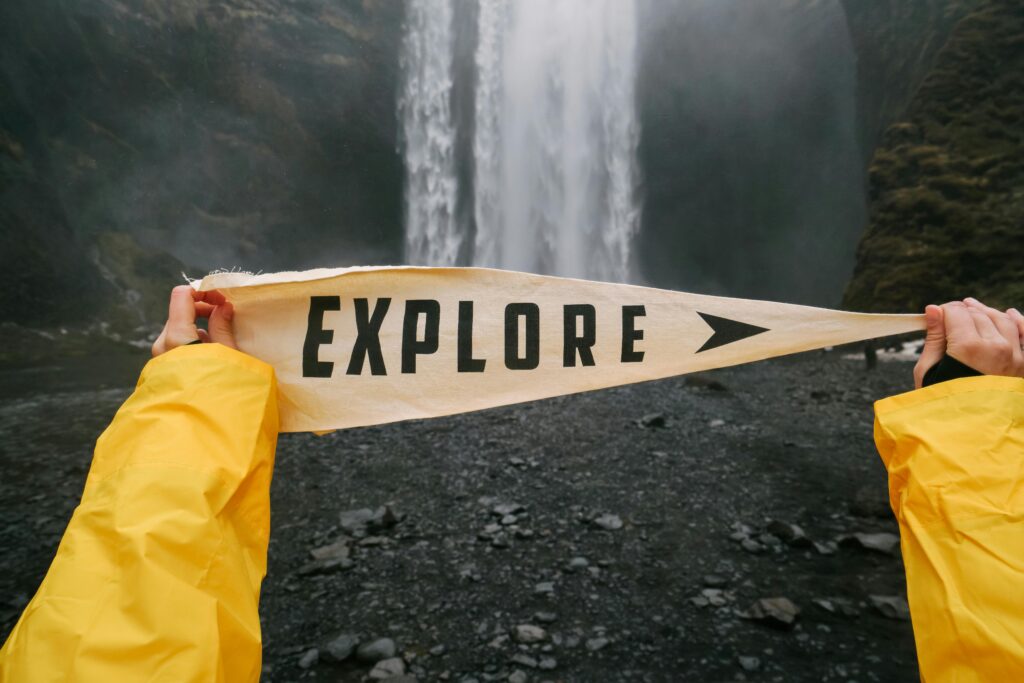 Discover the spirit of exploration with a scenic waterfall backdrop and a bold explore banner.
